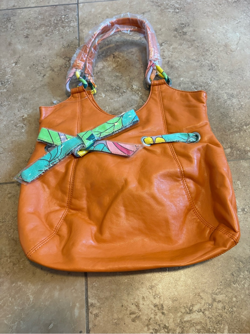 Orange Leather Shoulder Bag with Colorful Scarf Accent